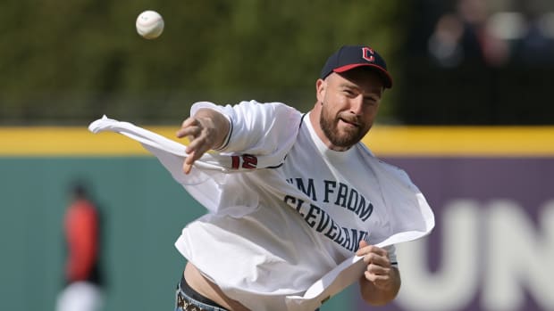 Travis Kelce throws out the first pitch at a Cleveland Guardians game.